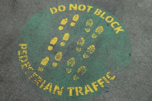 A “do not block” notice is painted on a pedestrian bridge at Las Vegas Boulevard and Harmon Avenue.