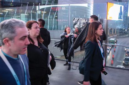 Violinist Felicia Zaharoff performs on a pedestrian bridge above Harmon Avenue on the Strip.