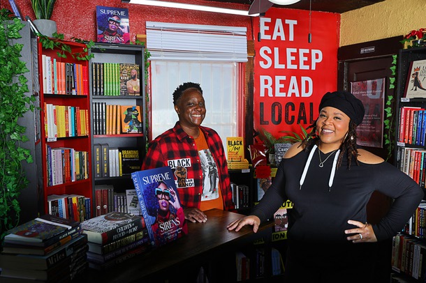 Owners Rochelle, left, and Charlie Luster pose in the Analog Dope Bookstore, 205 E. Colorado Ave., in the Arts District Thursday, March 7, 2024. The book selection features genres such as Activism, Socio-Political, Spirituality, Artistry, Business, Young Adult and Children's books centered in Black Culture, African Diaspora, and People of Color. They sell records too.