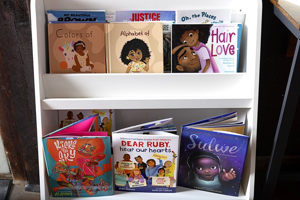 Children books are displayed at the Analog Dope Bookstore, 205 E. Colorado Ave., in the Arts District Thursday, March 7, 2024. The book selection features genres such as Activism, Socio-Political, Spirituality, Artistry, Business, Young Adult and Children's books centered in Black Culture, African Diaspora, and People of Color. They sell records too.