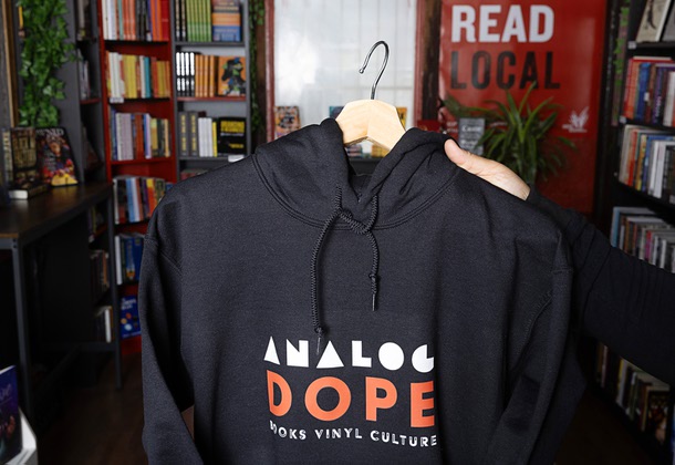 A hoodie is displayed at the Analog Dope Bookstore, 205 E. Colorado Ave., in the Arts District Thursday, March 7, 2024. The book selection features genres such as Activism, Socio-Political, Spirituality, Artistry, Business, Young Adult and Children's books centered in Black Culture, African Diaspora, and People of Color. They sell records too.