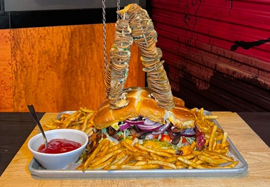 Area15’s The Beast eatery is serving up a Godzilla-sized burger that’s free if you finish it and costs $88 if you don’t. 