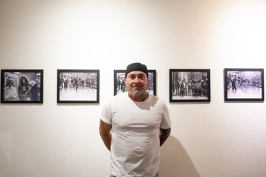 Legendary b-boy Mr. Freeze (Marc Lemberger) poses with photos of himself.