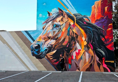 The mural recreates an encounter with a wild mustang in our Nevada wilderness using a palette of vivid, electric city colors.