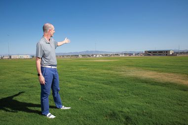 Clark County Commissioner Justin Jones shows natural turf fields at the events center at Desert Breeze Park.