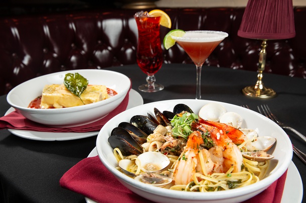 Seafood Fra Diavolo, lasagna, Venetian Spritz (left) and Bella Maria cocktail.