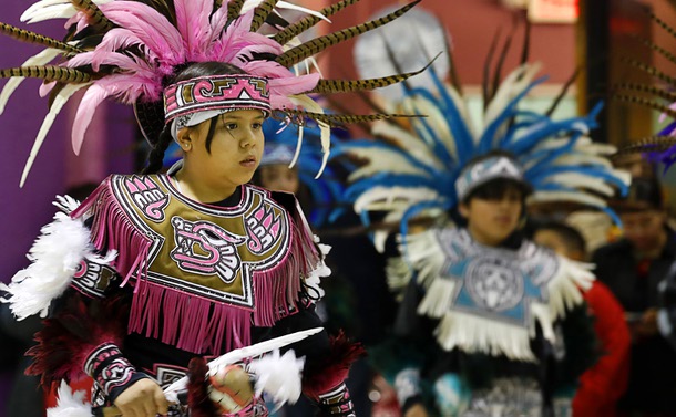 Members of Danza Azteca perform during the Celebracion de la Virgen de Guadalupe (Celebration of the Virgin of Guadalupe) at Holy Family Catholic Church Wednesday, Dec. 11, 2024.