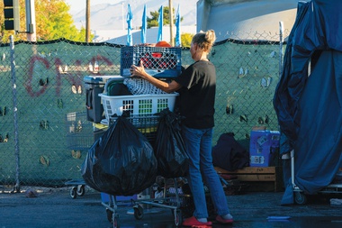 A couple packs up their belongings during Clark County Commissioner Tick Segerblom’s media walk-through by the La Villa Mobile Home Park on September 23,&nbsp;2024.