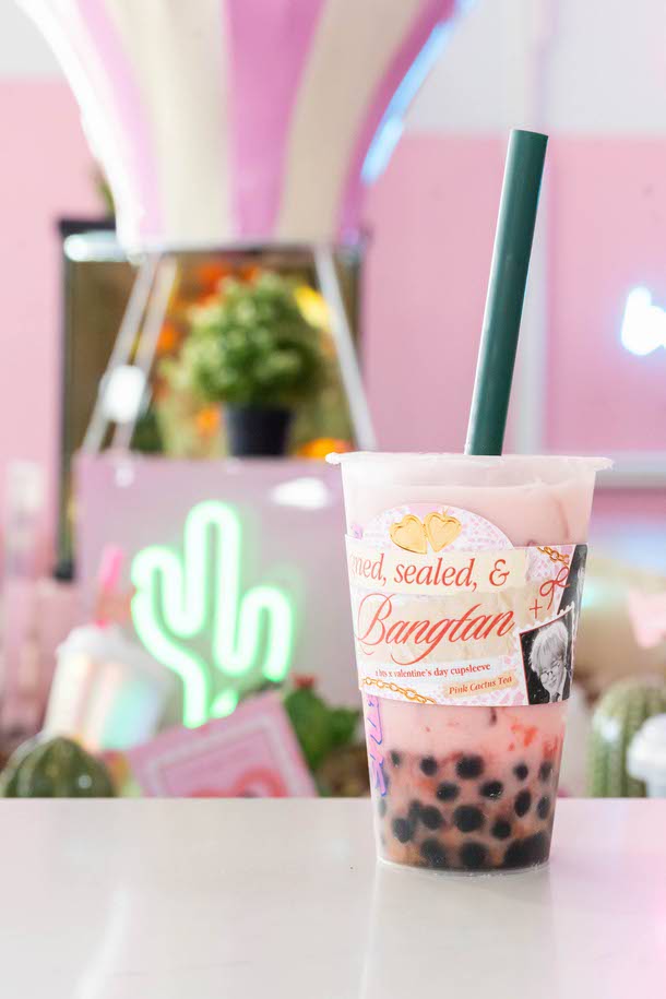 A BTS cup sleeve design is displayed at Pink Cactus Tea on February 15.
