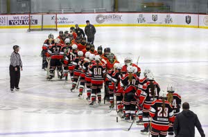 Members of the Vegas Jr. Golden Knights line up with the San Diego Angels during the USA Hockey Pacific District Girls Championships at the America First Center in downtown Henderson. 