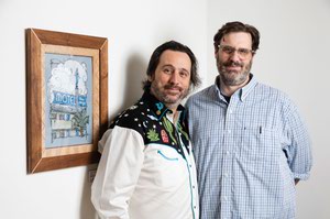 Artists Korey Replogle, left, and David Cooper with Cooper’s piece “Blue Angel Motel,” for which Replogle created a frame.