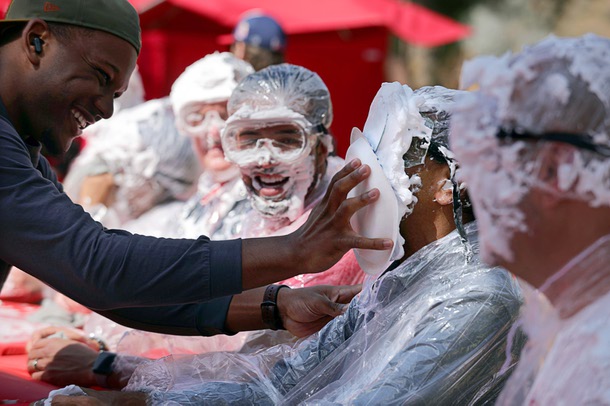 Rama Venkat, dean of the UNLV Hughes College of Engineering, is pied with a shaving cream pie during the “Rebels Give Pie on Pida” fundraising event at Pida Plaza on UNLV campus Thursday, March 27, 2025. Part of Rebels Give day, the event gives people a chance to pie UNLV leaders with a plate of shaving cream at $5.00 per plate.