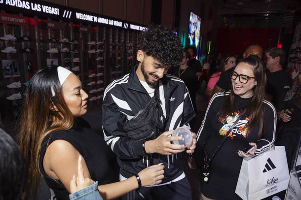 People attend a VIP pre-grand opening preview of a new Adidas store at the BLVD Vegas, Thursday, April 24, 2025.