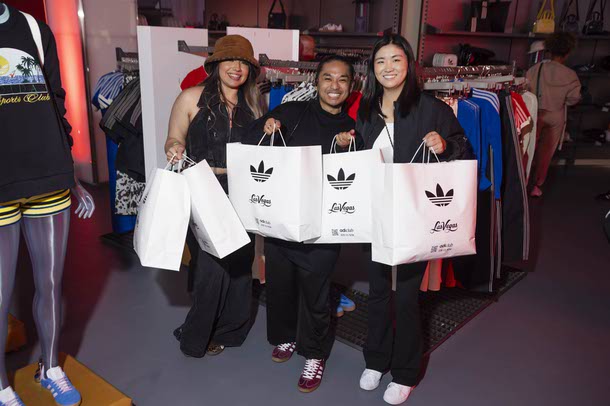 Professional golfer Rose Zhang, right, poses for a photo during a VIP pre-grand opening preview of a new Adidas store at the BLVD Vegas, Thursday, April 24, 2025.