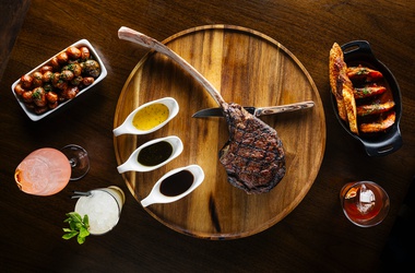 The Emmitt’s engraved tomahawk steak with Creole shrimp and patatas&nbsp;bravas.