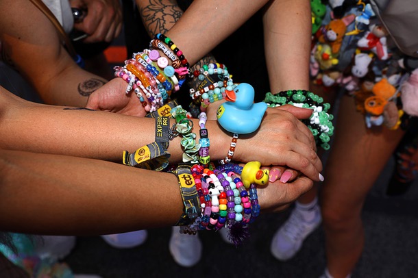 Festivalgoers display their beads during the first night of 2025 EDC at the Las Vegas Motor Speedway Friday, May 16, 2025.