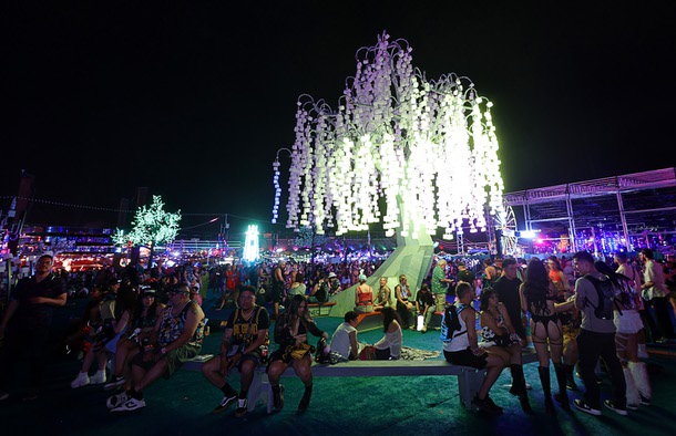 Festivalgoers relax under a light-up “tree” during the first night of 2025 EDC at the Las Vegas Motor Speedway Friday, May 16, 2025.