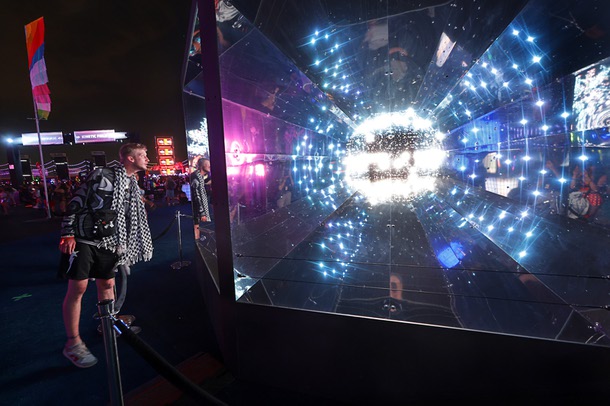 Clay Painter, of Houston, watches a light display during the first night of 2025 EDC at the Las Vegas Motor Speedway Friday, May 16, 2025.
