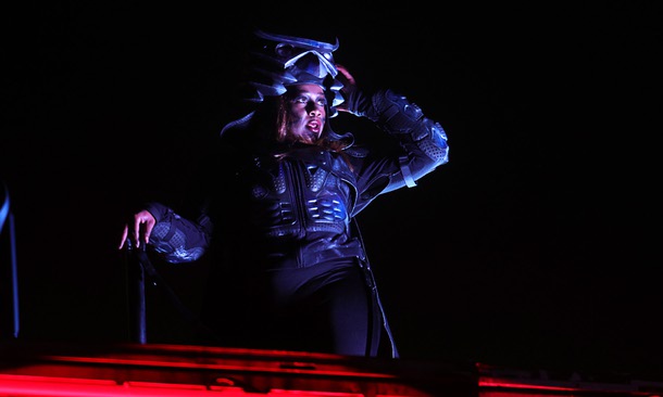 A performer dances on a stage in the Circuit Grounds during the first night of 2025 EDC at the Las Vegas Motor Speedway Friday, May 16, 2025.