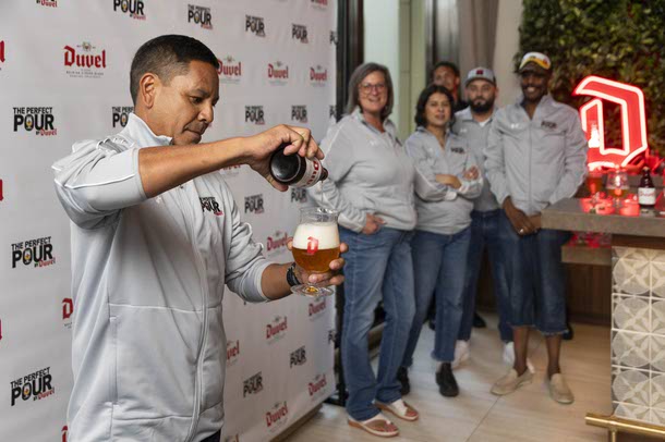 Tai Tolbert, bartender at Village Bottle Shop in Honolulu, HI, pours a Duvel Belgian Golden Ale during the 4th annual The Perfect Pour by Duvel contest at Wynn, Thursday, Aug. 7, 2025.