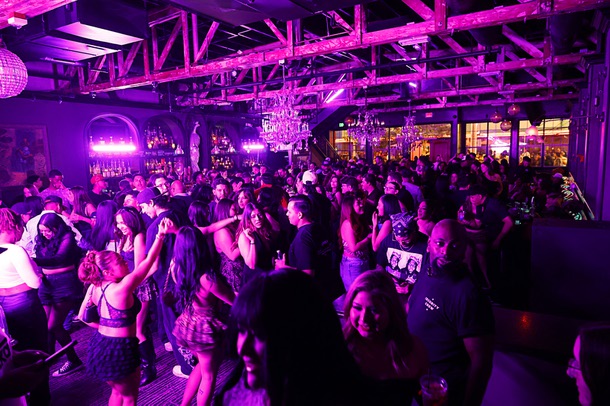 People dance at the Commonwealth in downtown Las Vegas Friday, Oct. 3, 2025.
