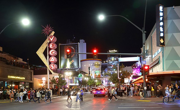 People cross East Fremonst Street at North Sixth Street in downtown Las Vegas Friday, Oct. 3, 2025.