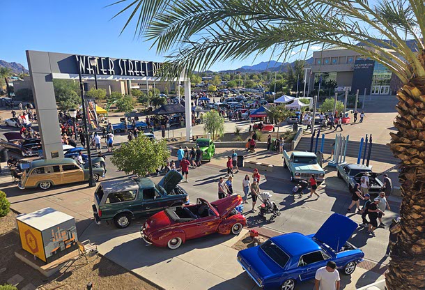 People look over vintage cars on Water Street  during the Henderson Hot Rod Days car show in downtown Henderson Saturday, Oct. 4, 2025.
