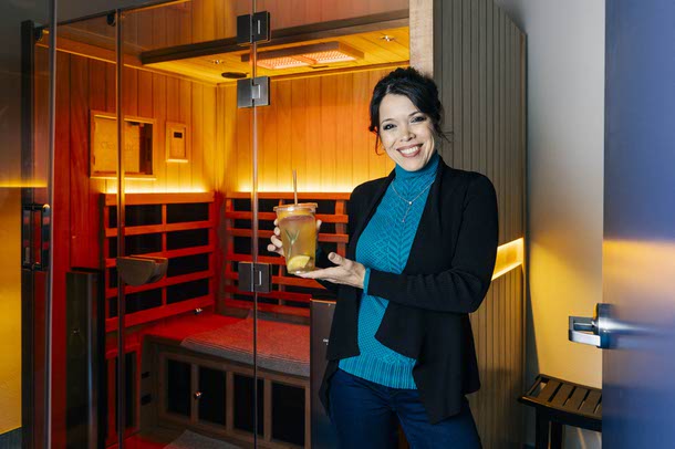 Michelle Zamora, owner of The Essential Element, poses for a photo in the sauna room, Tuesday, Nov. 25, 2025.