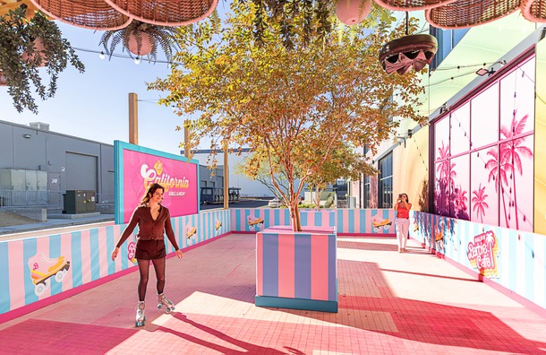 Keely O’Neal, senior project manager for Bucket Listers, skates in the Malibu Barbie Cafe at Area 15 Wednesday, Dec. 17, 2025.
