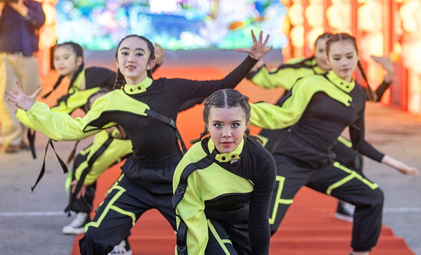 Students from the Noble Collegiate Academy perform at the opening of GlowFest, a holiday night market and light festival at Paradise Road and Sahara Avenue, Saturday, Dec. 20, 2025. The festival runs through Feb. 22.
