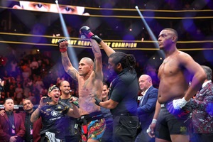 Alex Pereira is announced as the winner over Jamahal Hill after their title fight at UFC 300 at T-Mobile Arena on April 13, 2024.