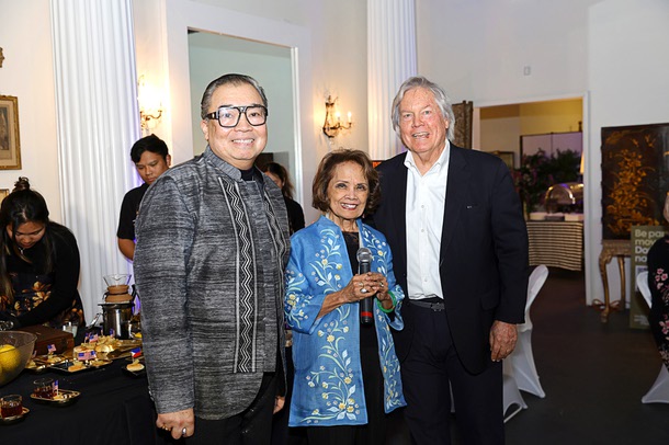 David Tupaz, left, chief curator and executive director of the Filipino American Museum, Rozita Lee, president of the museum board of directors, and Clark County Commissioner Tick Segerblom pose during a soft opening of the  in the Boulevard mall Saturday, Feb. 7, 2026.