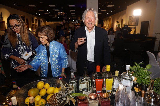 Clark County Commissioner Tick Segerblom tries a Filipino drink during a soft opening of the museum in the Boulevard mall Saturday, Feb. 7, 2026. Rozita Lee, president of the Filipino American Museum board of directors, is at left.