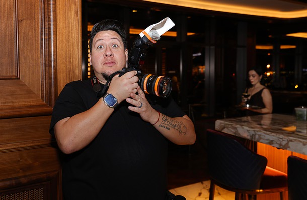 Greenspun Media Group photographer Christopher DeVargas works during a reception in the Alle Lounge on 66 before the C-Suite Honors event at Resorts World Wednesday, Feb. 25, 2026.