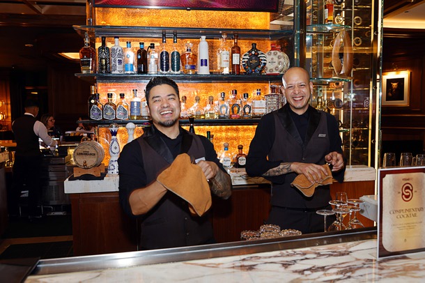 Bartenders work the bar during a reception in the Alle Lounge on 66 before the C-Suite Honors event at Resorts World Wednesday, Feb. 25, 2026.