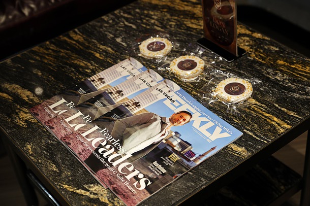 Copies of Las Vegas Weekly and cookies from Freed's Bakery are displayed during the C-Suite Honors event in the Zouk Nightclub at Resorts World Wednesday, Feb. 25, 2026.