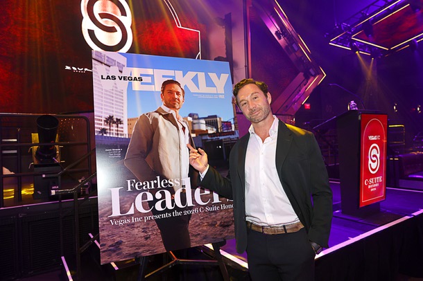 Honoree Jason Strauss, left, co-CEO of Tao  Group Hospitality, points to his photo on an oversize mock-up of Las Vegas Weekly during the C-Suite Honors event in the Zouk Nightclub at Resorts World Wednesday, Feb. 25, 2026.