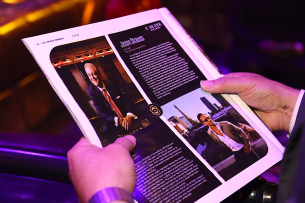 A guest looks through a Las Vegas Weekly magazine during the C-Suite Honors event in the Zouk Nightclub at Resorts World Wednesday, Feb. 25, 2026.