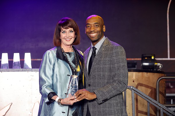 Honoree Sallie Doebler, CEO for Las Vegas Mayor’s Fund for Las Vegas LIFE, poses with Michael Crome, senior vice president and CFO for the Las Vegas Raiders, during the C-Suite Honors event in the Zouk Nightclub at Resorts World Wednesday, Feb. 25, 2026. Crome served as emcee for the event.