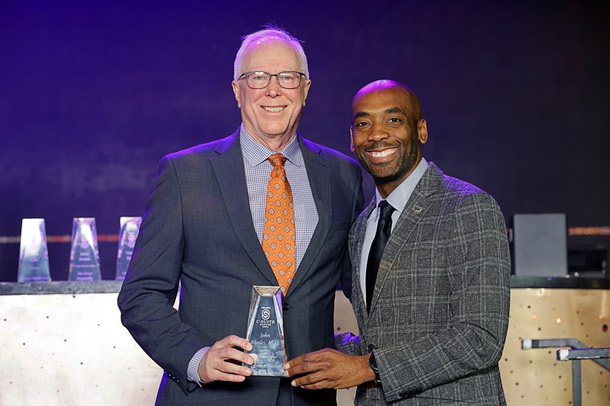 Honoree John Rhodes, left, president/CEO Southwest Medical and Optum Nevada, poses with Michael Crome, senior vice president and CFO for the Las Vegas Raiders, during the C-Suite Honors event in the Zouk Nightclub at Resorts World Wednesday, Feb. 25, 2026. Crome served as emcee for the event.