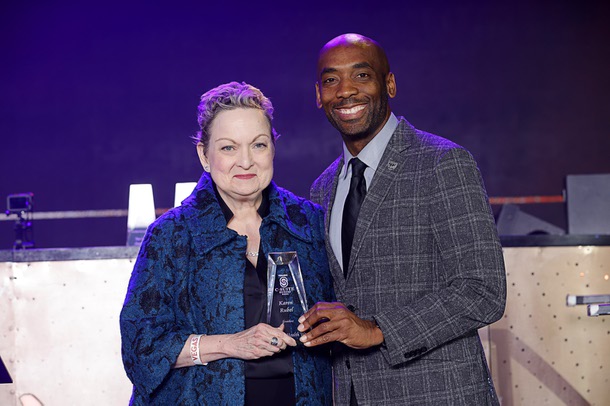 Caleen Norrod Johnson, left, who accepted the award for honoree Karen Rubel, president of Chapters Health West and interim executive director for the Nathan Adelson Hospice Foundation, poses with Michael Crome, senior vice president and CFO for the Las Vegas Raiders, during the C-Suite Honors event in the Zouk Nightclub at Resorts World Wednesday, Feb. 25, 2026. Crome served as emcee for the event.