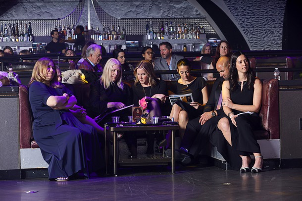 Honoree Kim Virtuoso, far right, chief people officer for Fontainebleau Las Vegas, waits with members of her team during the C-Suite Honors event in the Zouk Nightclub at Resorts World Wednesday, Feb. 25, 2026.
