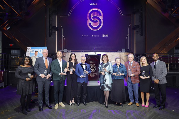 Honorees pose with Michael Crome, far right, during the C-Suite Honors event in the Zouk Nightclub at Resorts World Wednesday, Feb. 25, 2026. Honorees, from left, are: Sonja Roberts, who accepted the award for Uri Clinton, John Rhodes, Jason Strauss, Kim Virtuoso, Scott Rosenzweig, Sallie Doebler, Caleen Norrod Johnson, who accepted the award for Karen Rubel, Don Logan and M.J. Maynard-Carey.