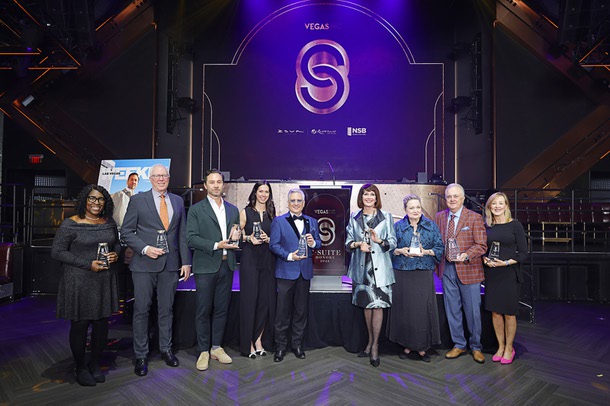 Honorees pose during the C-Suite Honors event in the Zouk Nightclub at Resorts World Wednesday, Feb. 25, 2026. Honorees, from left, are: Sonja Roberts, who accepted the award for Uri Clinton, John Rhodes, Jason Strauss, Kim Virtuoso, Scott Rosenzweig, Sallie Doebler, Caleen Norrod Johnson, who accepted the award for Karen Rubel, Don Logan and M.J. Maynard-Carey.