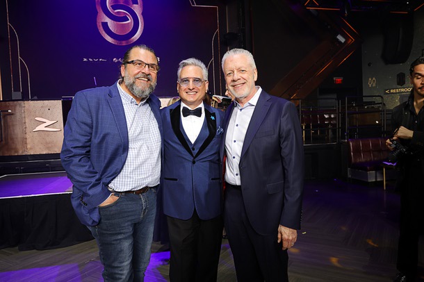 Honoree Scott Rosenzweig, center, president/CEO of Make A Wish Nevada, poses with friends during the C-Suite Honors event in the Zouk Nightclub at Resorts World Wednesday, Feb. 25, 2026.