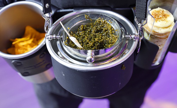 A mobile caviar waiter from Stardust Caviar is shown during the C-Suite Honors event in the Zouk Nightclub at Resorts World Wednesday, Feb. 25, 2026.