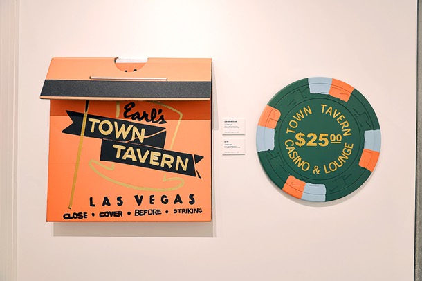 An oversized Town Tavern matchbook and gaming chip by Courtney Yards are displayed at the “Rhythm and Resilience: Black Vegas” exhibit in the Las Vegas Civic Center Gallery Thursday, March 12, 2026. Curated by Carmen Beals and narrated by historian Claytee White, the exhibit explores African American life in Las Vegas.