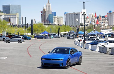 A 2026 Dodge Charger Daytona electric muscle car is taken for a test drive during an Electric Vegas Recycle & Ride event at Allegiant Stadium Saturday, April 4, 2026. The car features dual electric motors producing up to 670 horsepower, achieving 0–60 mph in 3.3 seconds. A Fratzonic Chambered Exhaust system simulates the sound of a traditional gasoline-powered V8 engine.