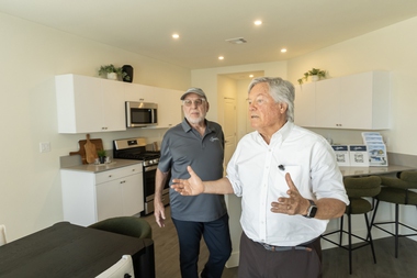 Signature Homes CEO Richard Plaster (left) and Clark County Commissioner Tick Segerblom tour a model home at Paradise Trails on March&nbsp;25.