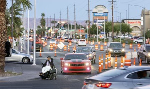 A woman with a motorized wheelchair prepares to cross South Decatur Boulevard at West Charleston Boulevard on April 3. 